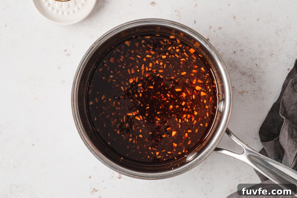 The sauce for the chicken in a pot.
