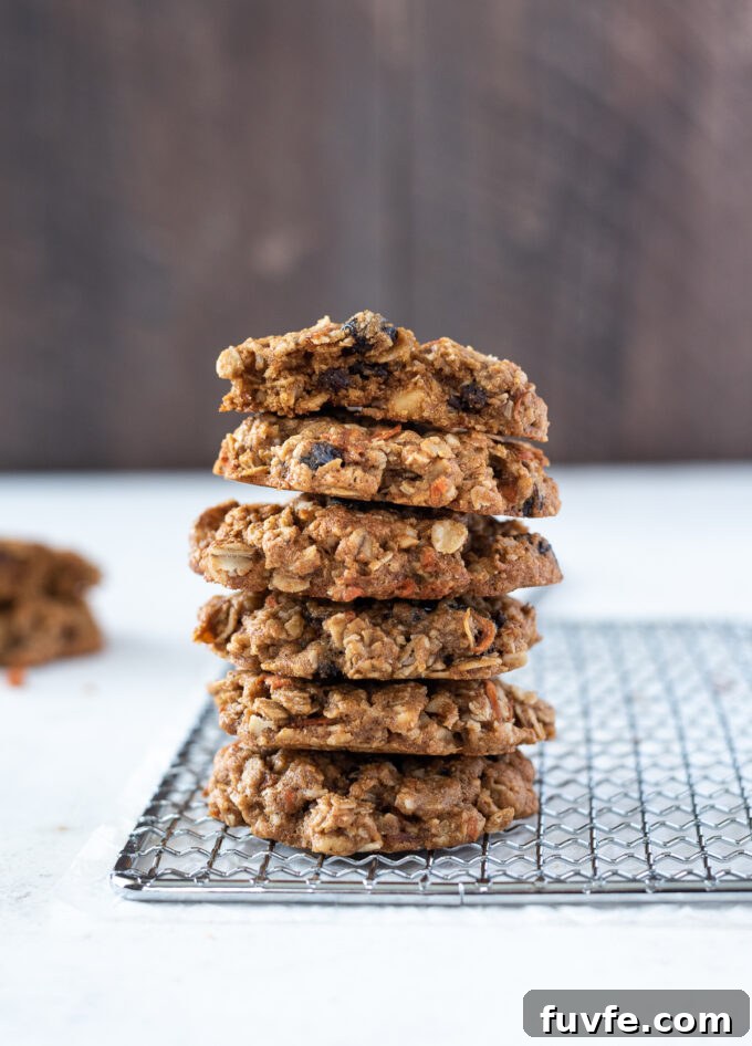 Chewy Carrot Oatmeal Cookies Recipe 2 Stack of carrot oatmeal cookies on a wire rack.