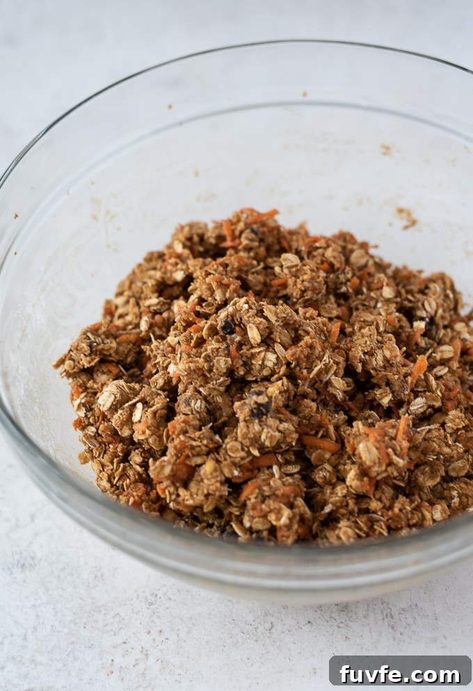 Chewy Carrot Oatmeal Cookies Recipe 6 Combining oats and flour into cookie dough.
