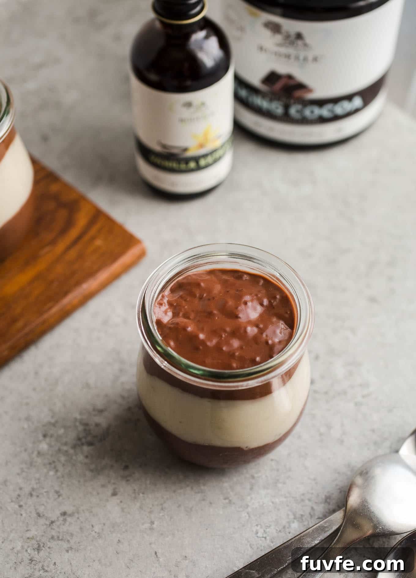 Vegan Chocolate Vanilla Pudding Cups made with rich chocolate cocoa powder, coconut milk, almond milk, maple syrup, and pure vanilla extract. An easy gluten-free, dairy-free pudding recipe!