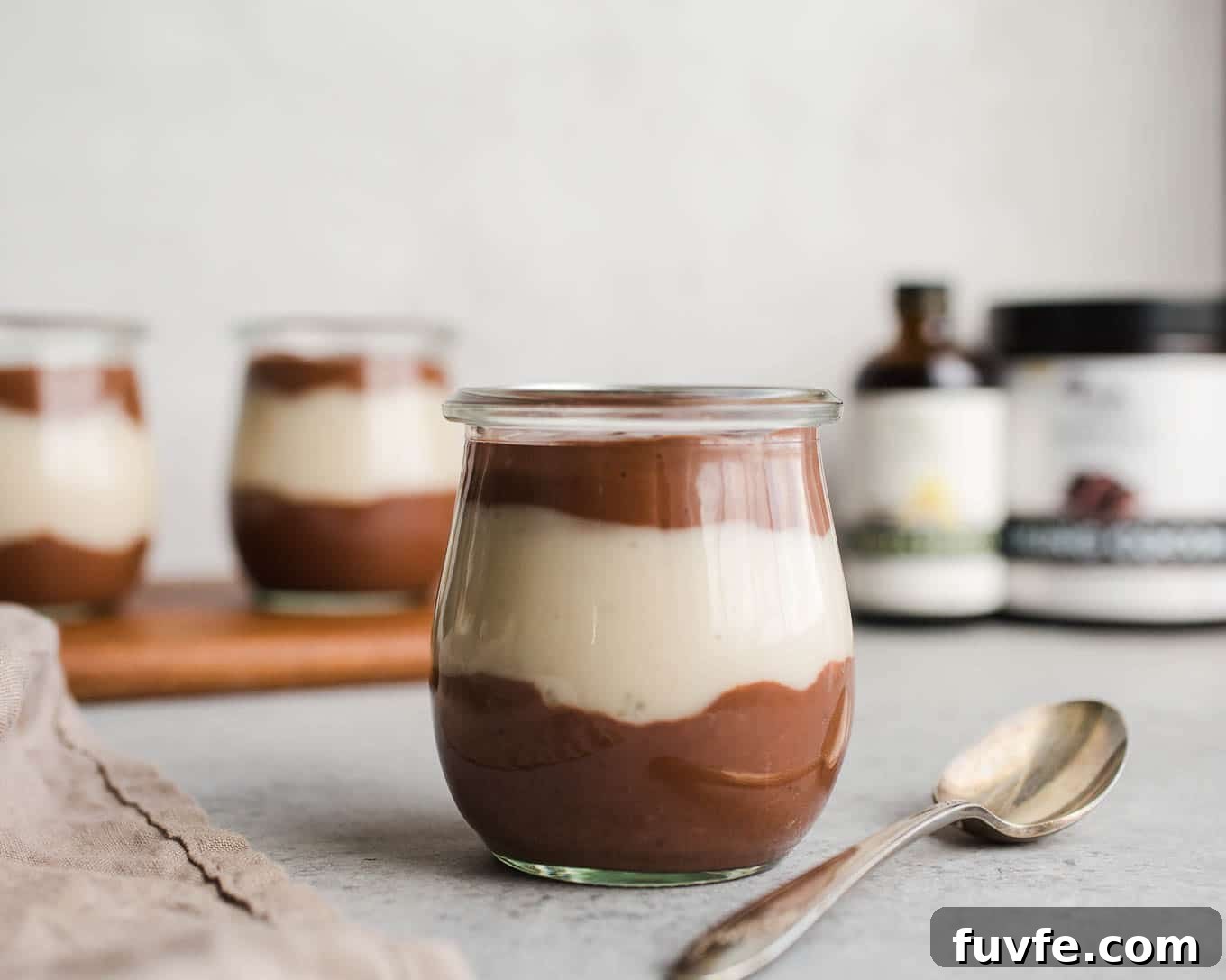 Vegan Chocolate Vanilla Pudding Cups made with rich chocolate cocoa powder, coconut milk, almond milk, maple syrup, and pure vanilla extract. An easy gluten-free, dairy-free pudding recipe!
