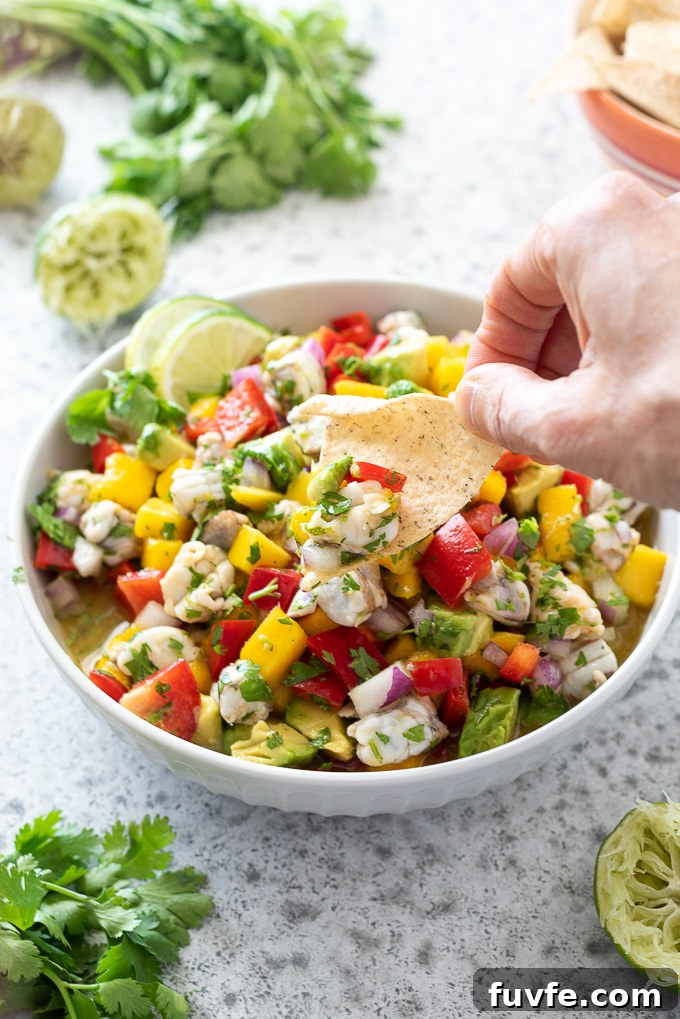 Chip dipped into shrimp ceviche