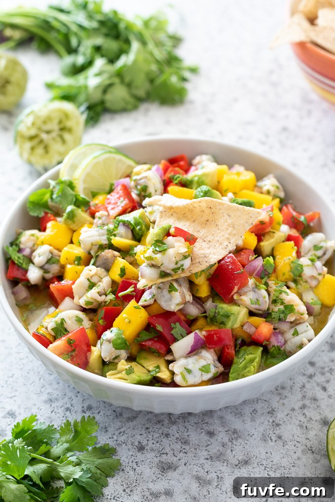 Shrimp ceviche in a bowl with a chip in the middle