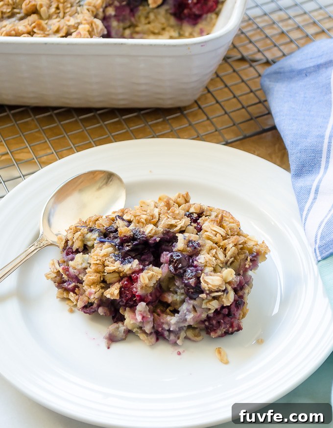 Make Ahead Blueberry Baked Oatmeal 6 Serving of blueberry baked oats on a plate