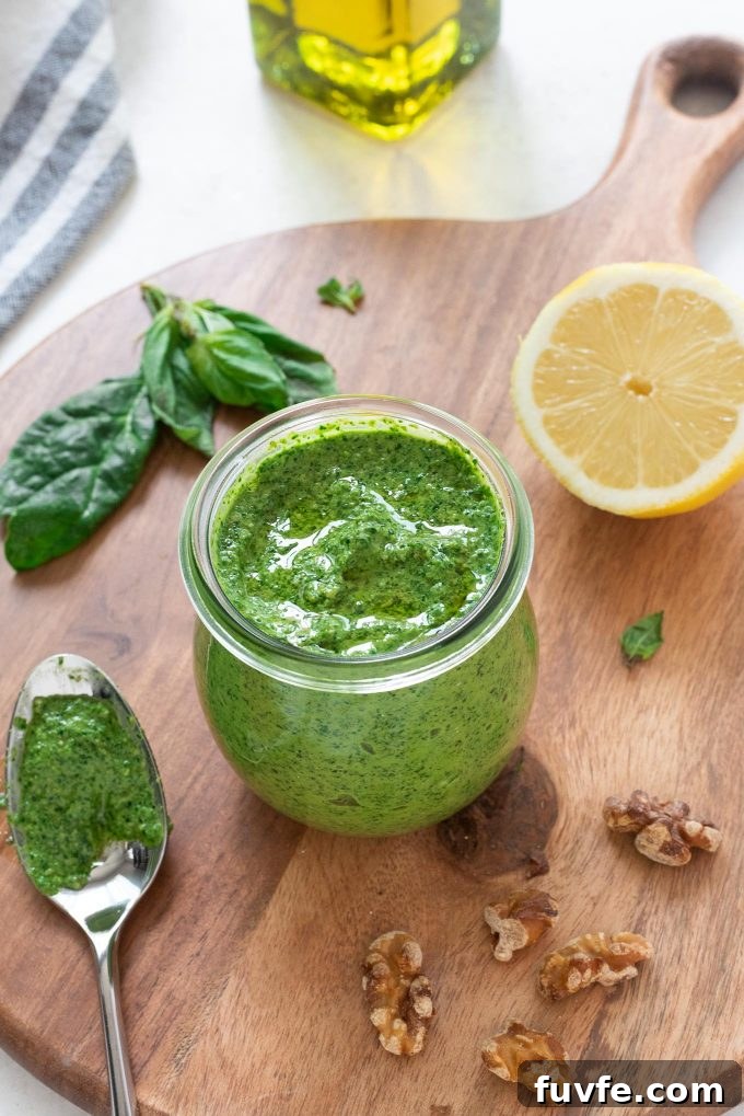 Spinach pesto in a jar with olive oil on top
