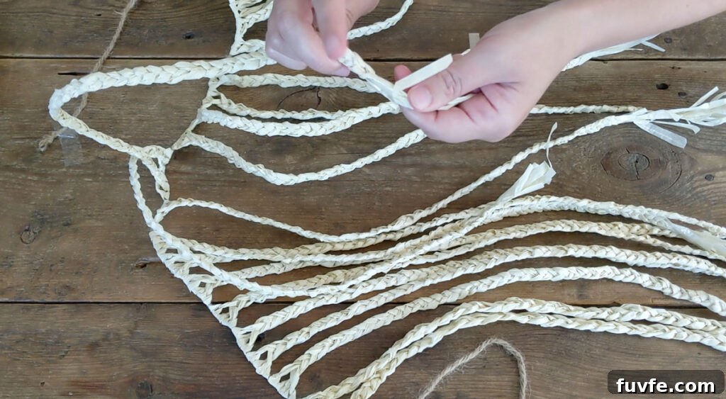 Create a Stunning Ombré Basket: Step-by-Step DIY Guide 3 Braid 20 ropes of raffia using bundles of 3 - 4 strands.