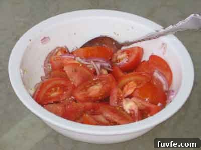 Authentic Greek Tomato Salad (Ntomatosalata) Recipe 3 Greek tomato salad, ntomatosalata, dressed with olive oil.