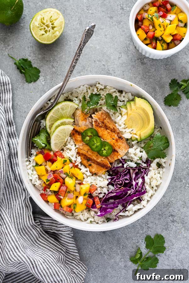 fish taco bowl tilted slightly with fork and linen