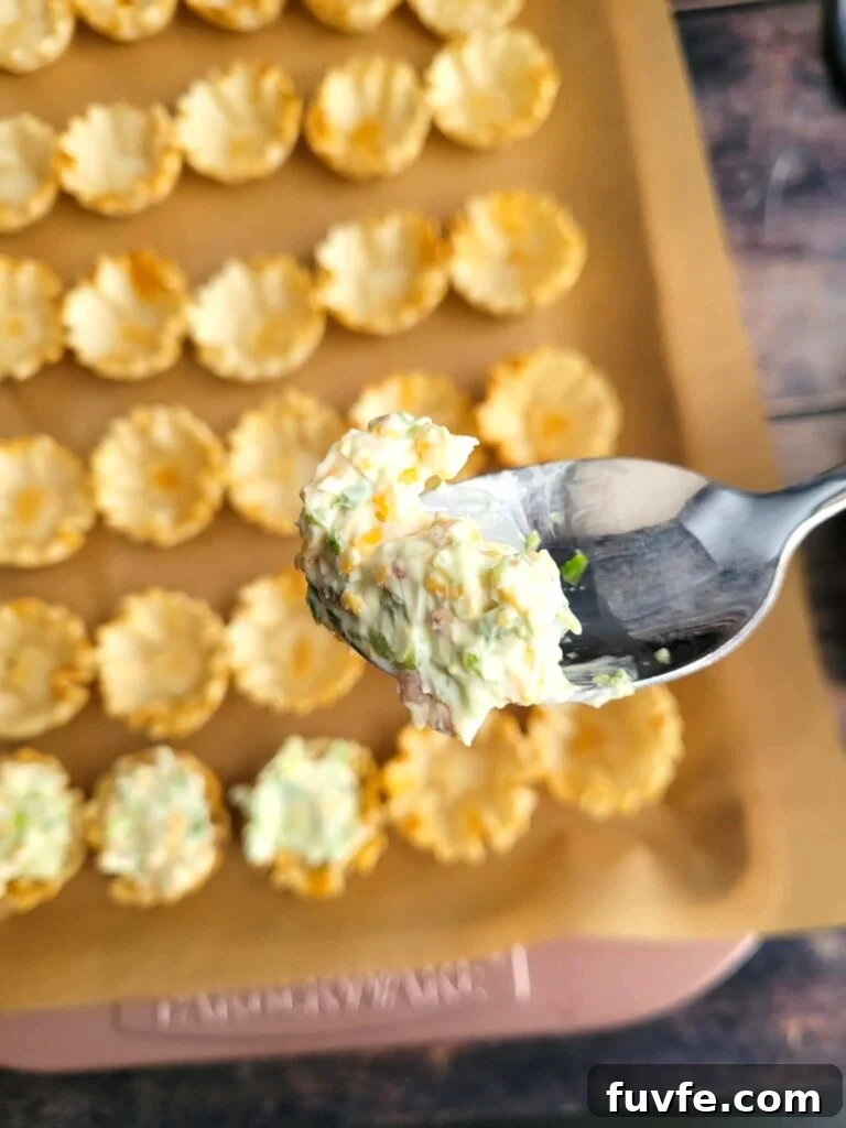 Crispy Jalapeño Popper Phyllo Bites: Creamy, Spicy Appetizer 6 filling the cups with the cheese filling