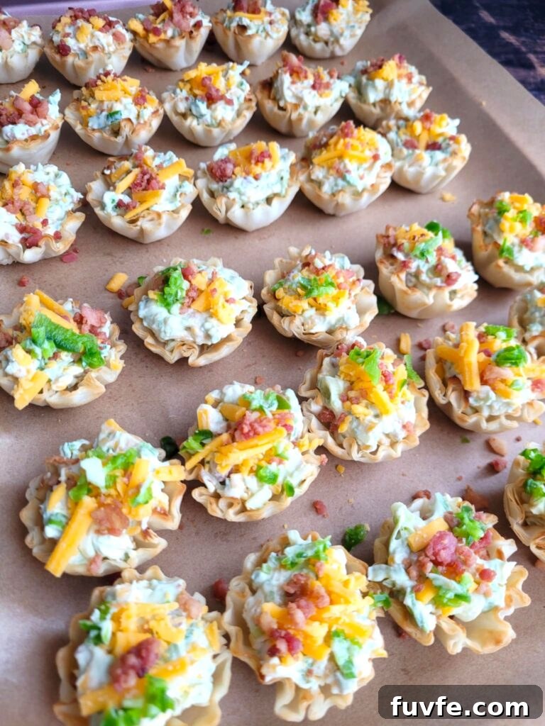 Crispy Jalapeño Popper Phyllo Bites: Creamy, Spicy Appetizer 8 tray of cheese popper bites with and without jalapeno garnish