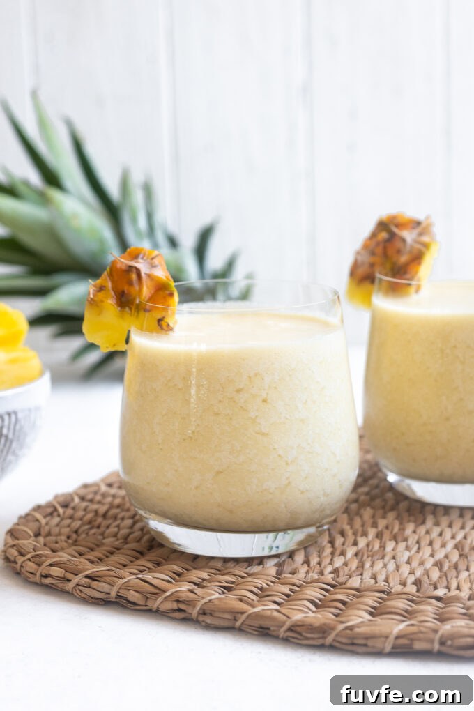 Pina colada with dark rum poured into glasses.