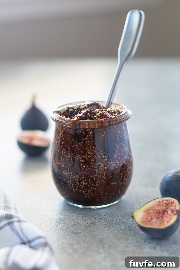 Spoon buried in a jar of fig jam