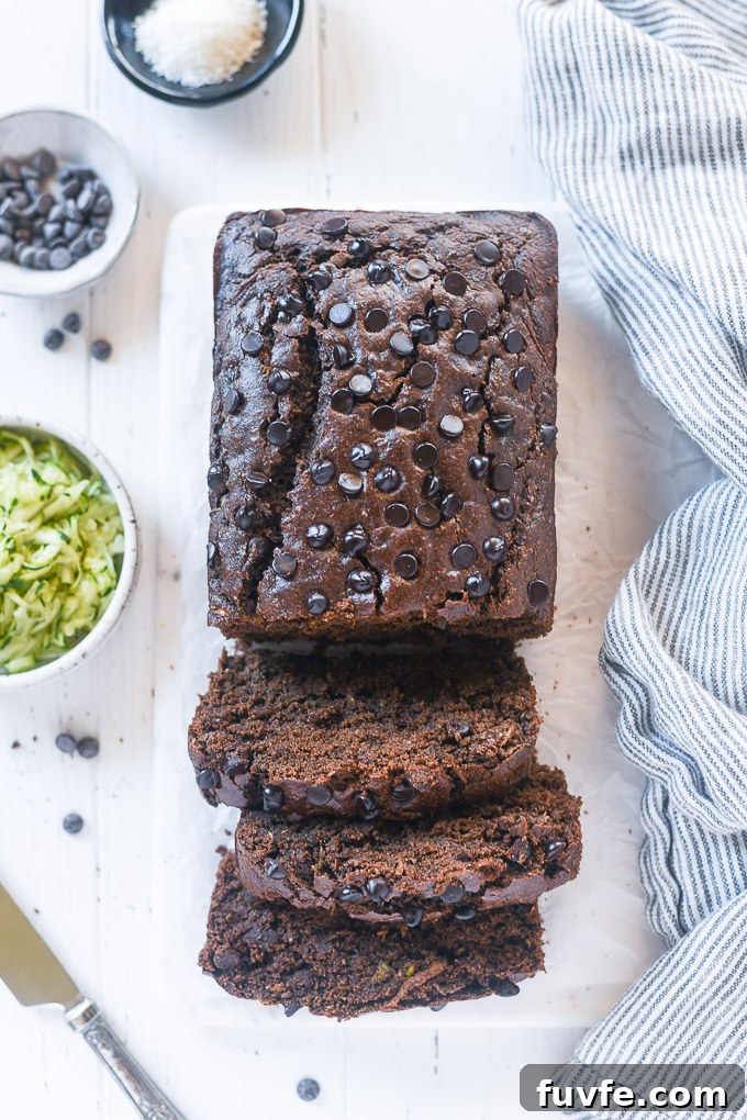 Chocolate Zucchini Loaf sliced on a cutting board