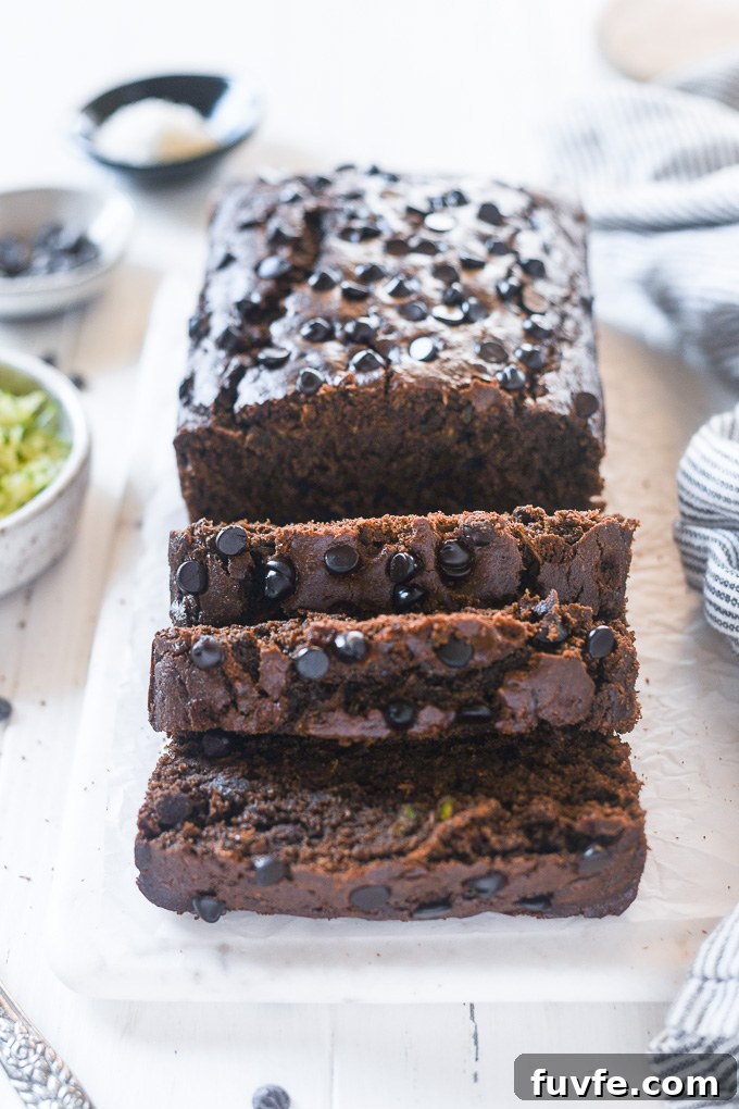 Slices of chocolate zucchini bread cut from loaf
