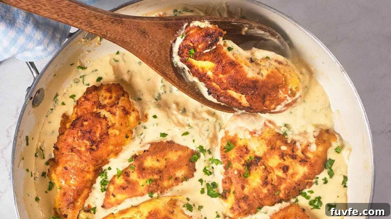 A skillet filled with chicken francese garnished with chopped herbs, being stirred with a wooden spoon.
