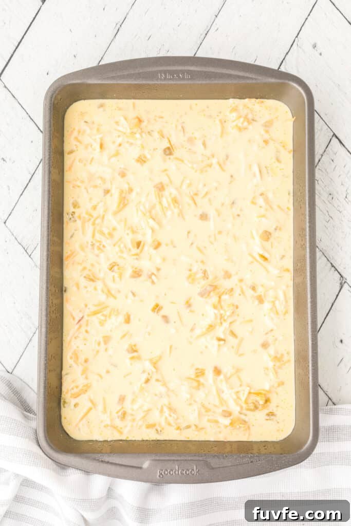 Unbaked Chilies Rellenos Bake mixture in a greased baking dish