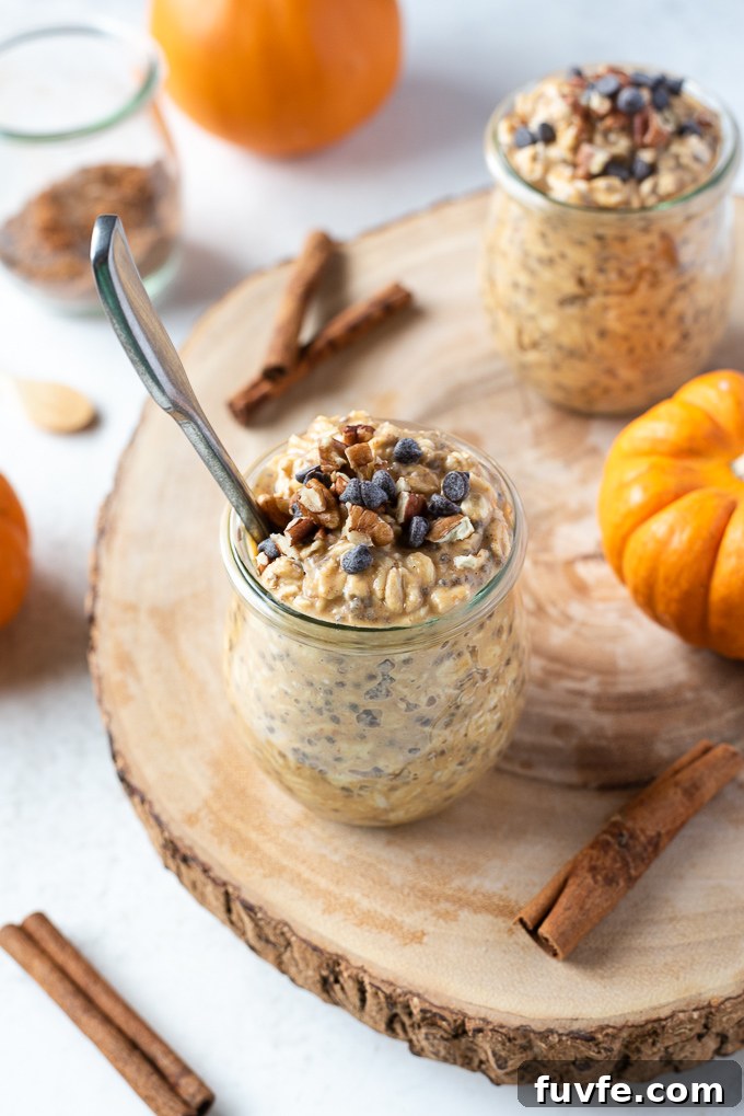 Pumpkin overnight oats in a jar with spoon buried in the middle