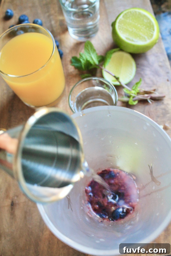 pour gin into cocktail