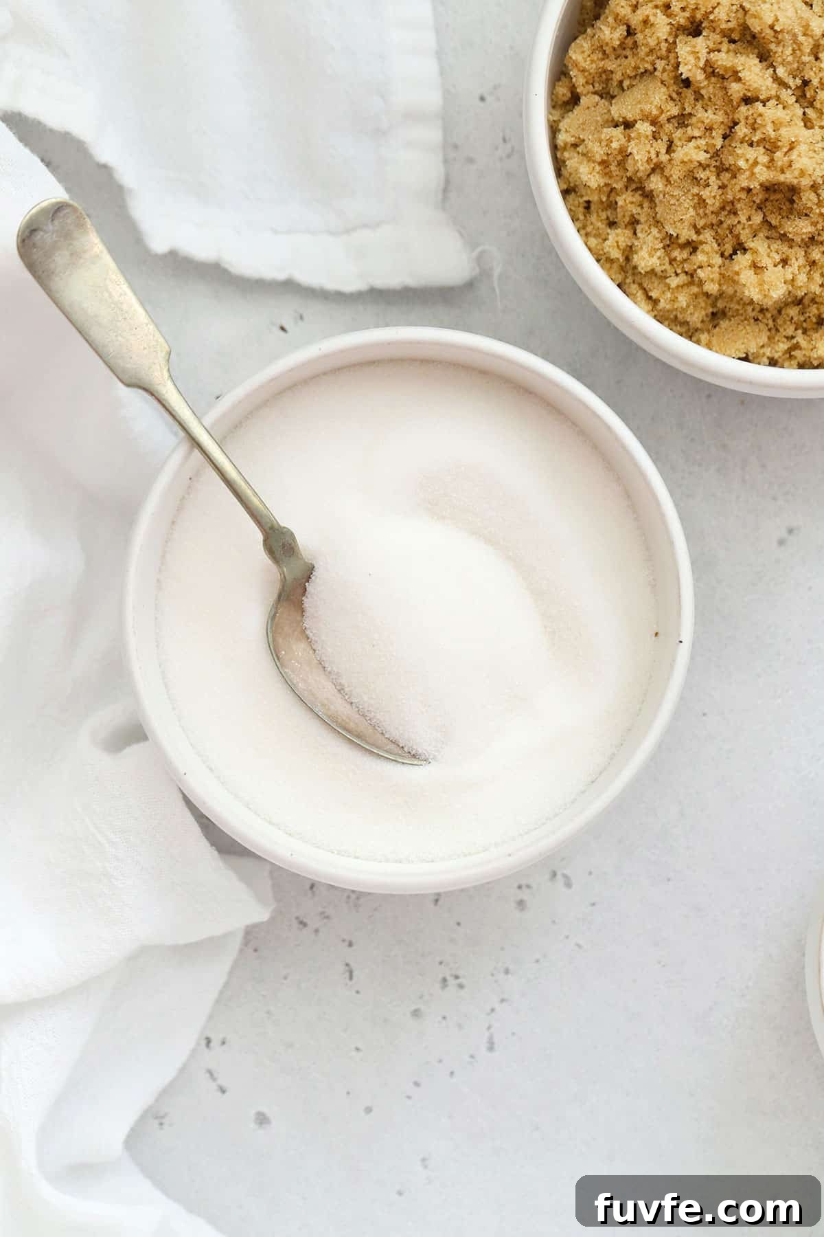 Is Sugar Gluten-Free? What You Need to Know About Sugars and Gluten 4 white sugar in a white bowl