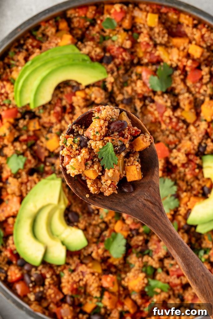 Spoonful of Mexican quinoa over the pan