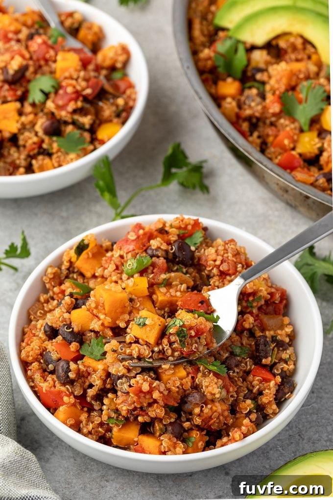 Bowl of Mexican quinoa with fork digging in