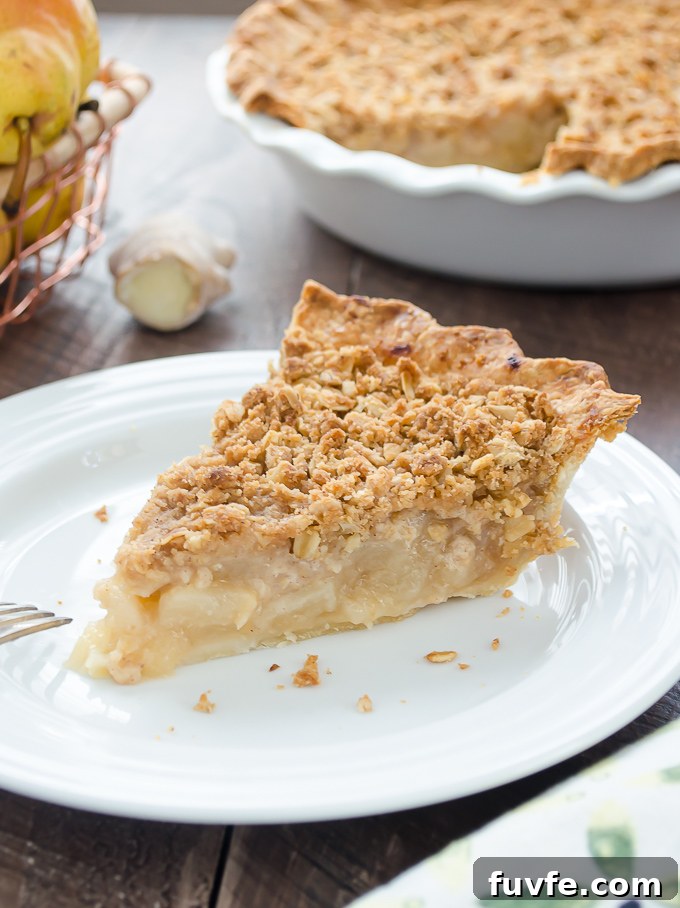 Pear pie with streusel topping on a plate
