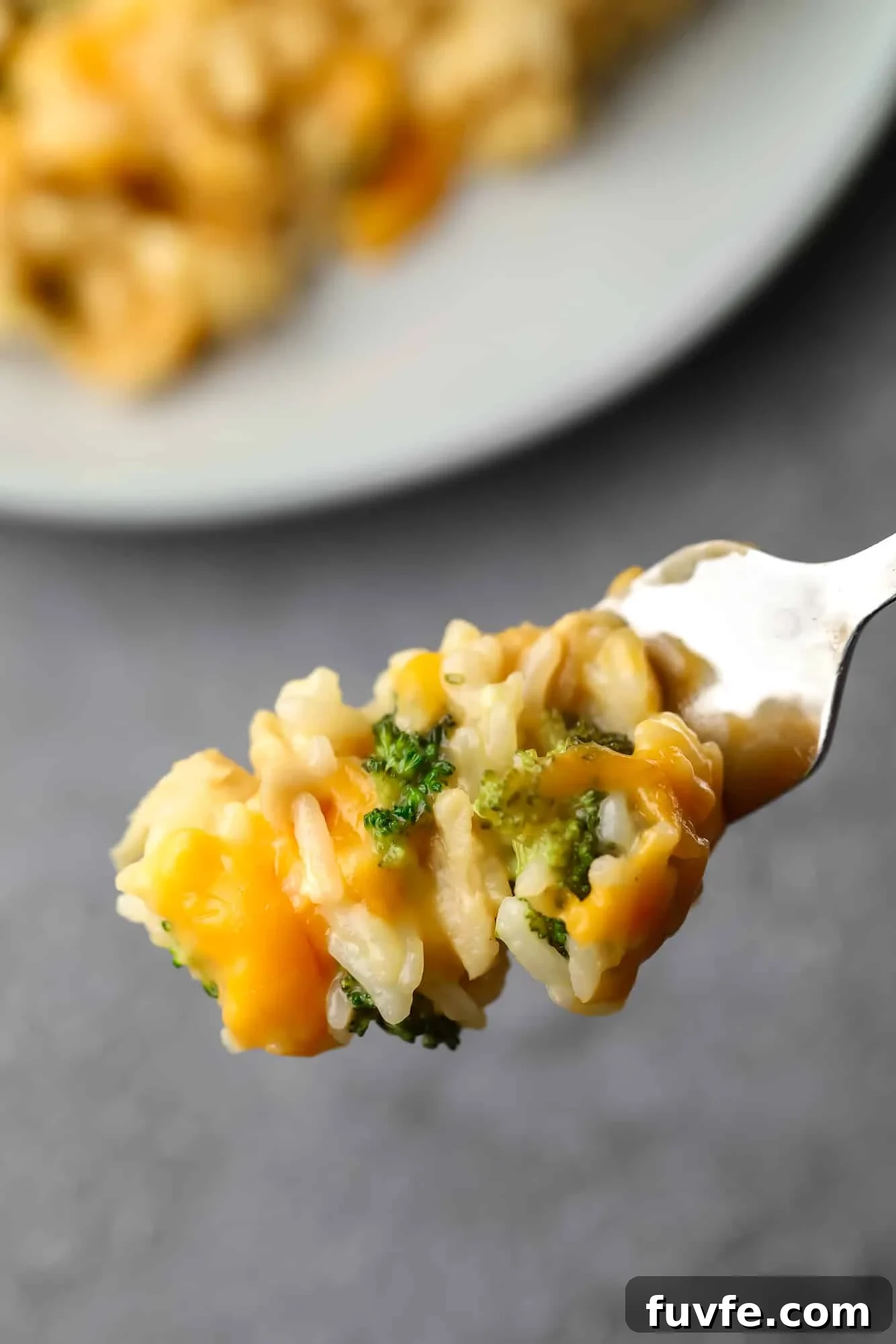 close up on a forkful of a vegan chicken broccoli rice casserole.