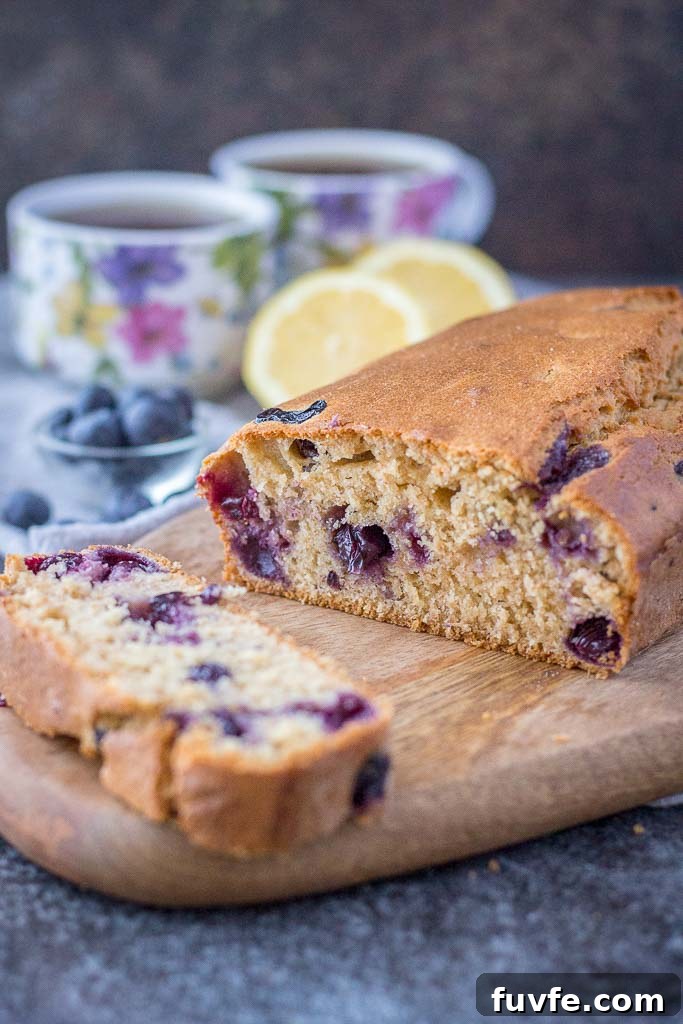Healthy whole grain refined sugar-free Lemon Blueberry Pound Cake with fresh blueberries