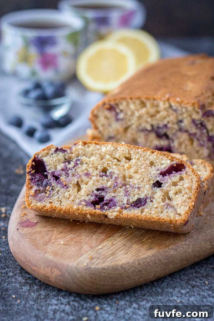 Healthy whole grain refined sugar-free Lemon Blueberry Pound Cake with fresh blueberries