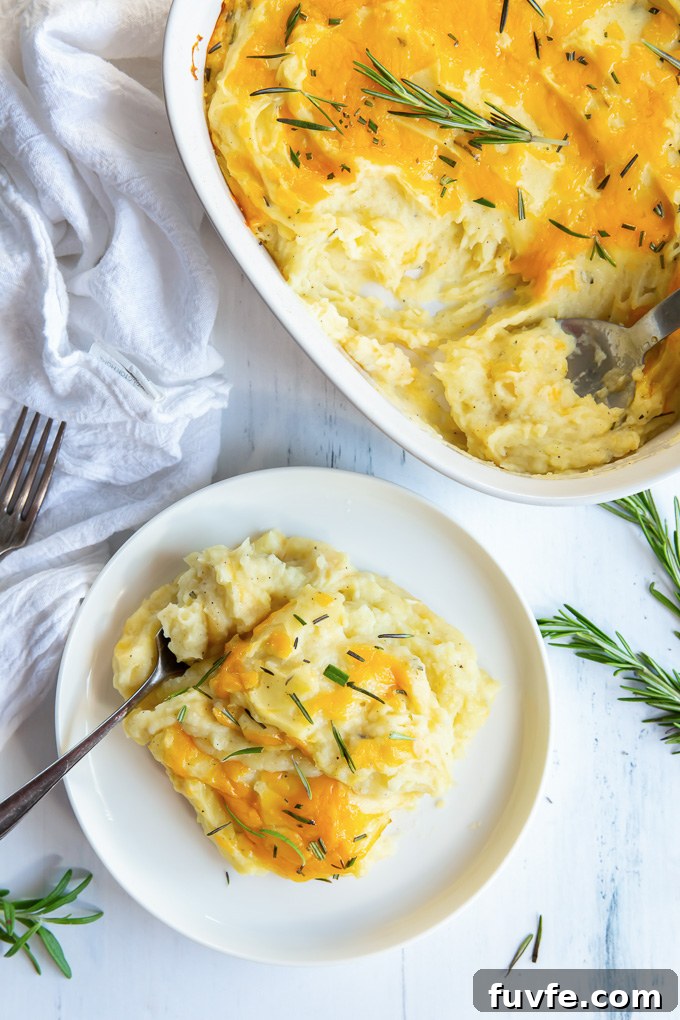 Serving of twice baked mashed potatoes on a white plate
