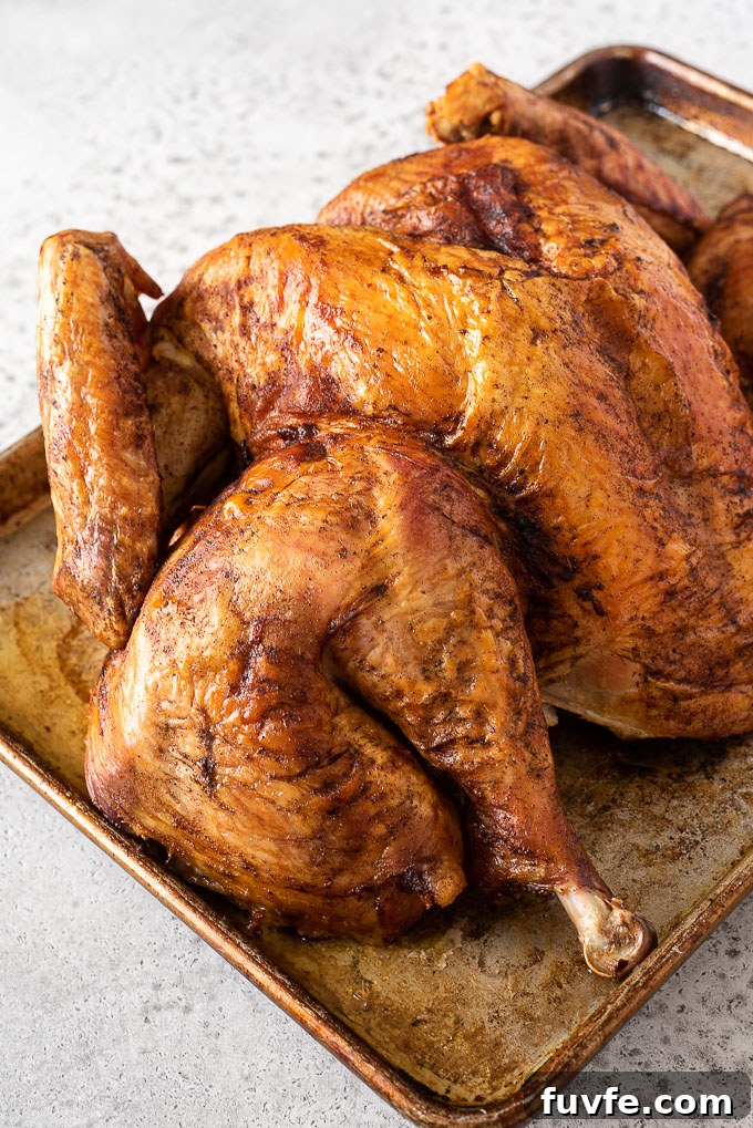 Spatchcock turkey on a baking sheet