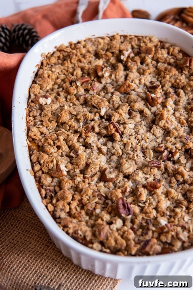 Butternut squash casserole with streusel topping in a baking dish