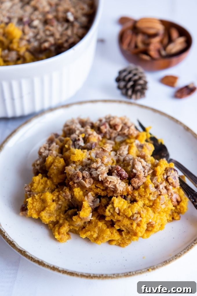 Serving of butternut squash casserole on a white plate