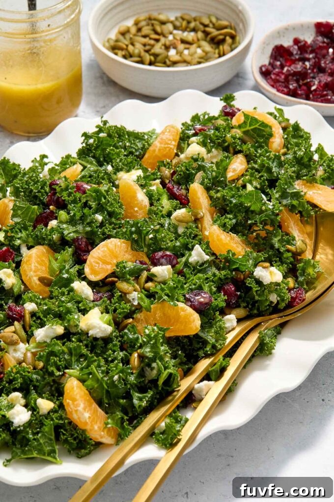 Kale and Orange Salad with Citrus Vinaigrette Recipe 3 Kale salad with cranberries on a platter.
