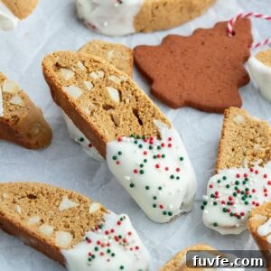 Gingerbread Biscotti Recipe for Holiday Mornings 9 Gingerbread biscotti dipped in white chocolate with sprinkles