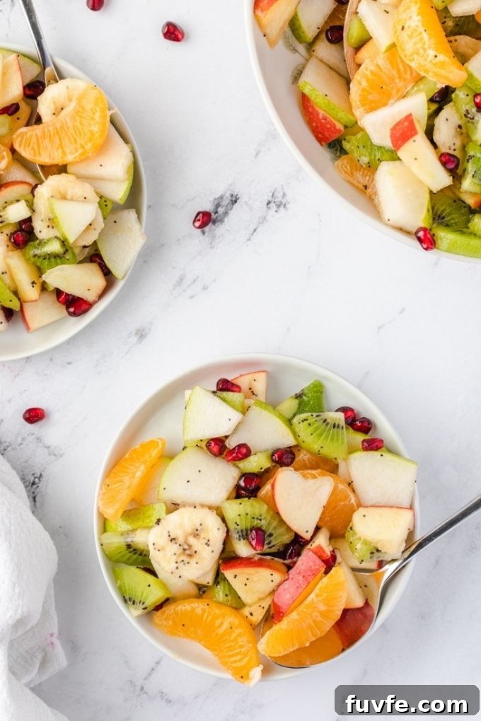 Winter Citrus and Pomegranate Fruit Salad 7 Servings of winter fruit salad on small white plates