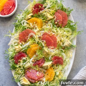 Frisée citrus salad on a platter.
