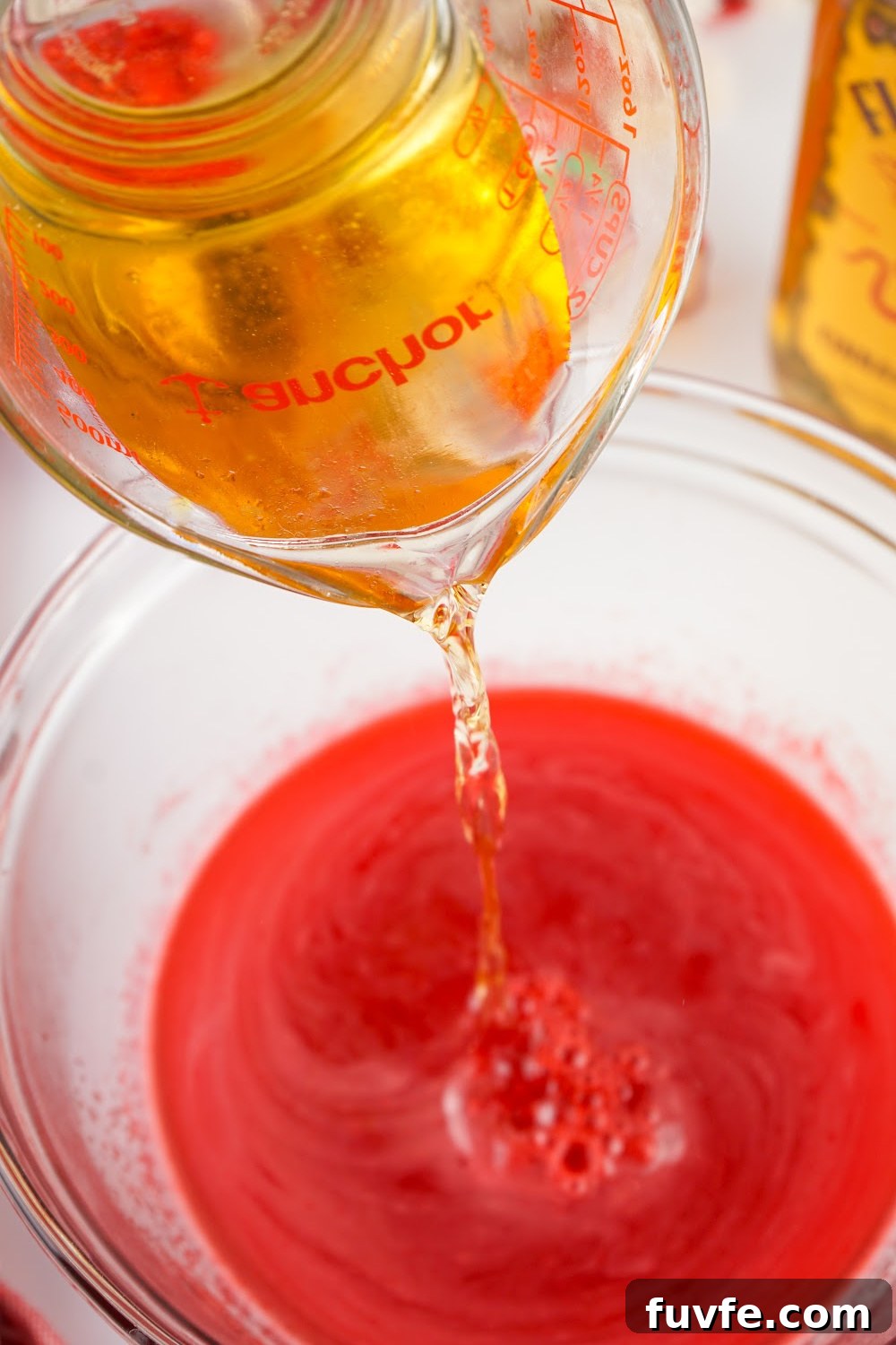 how to make fireball jello shots adding Fireball whiskey to the jello.