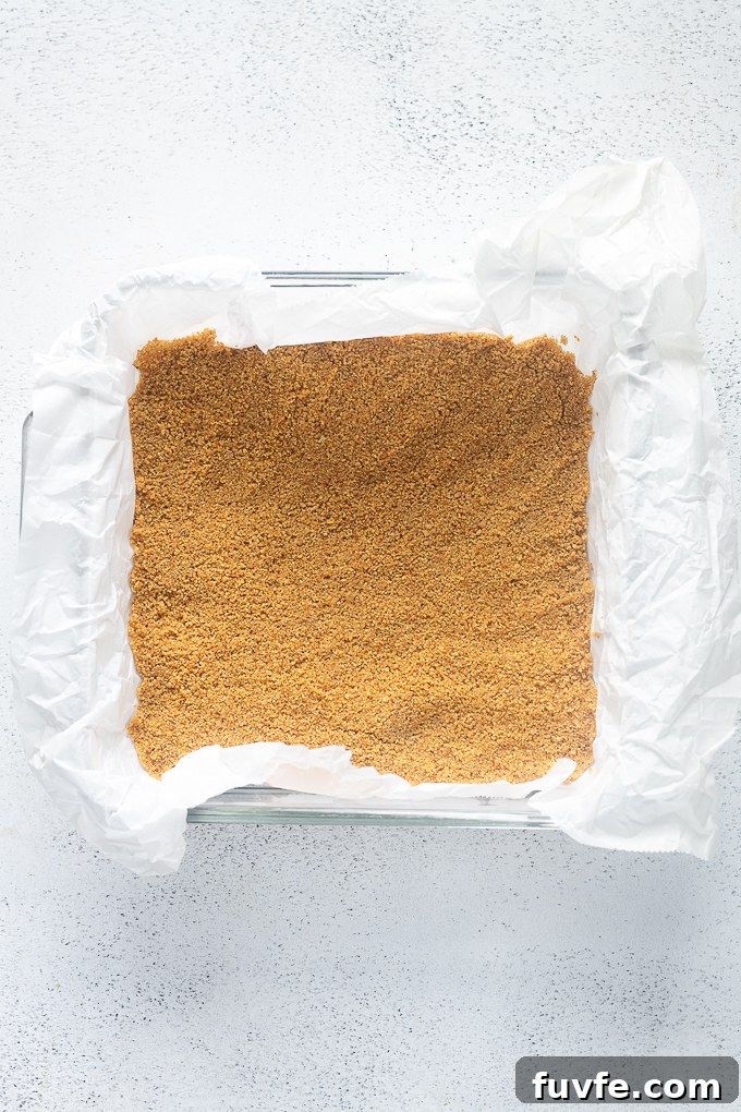 Baked graham cracker crust in 8x8" baking dish.