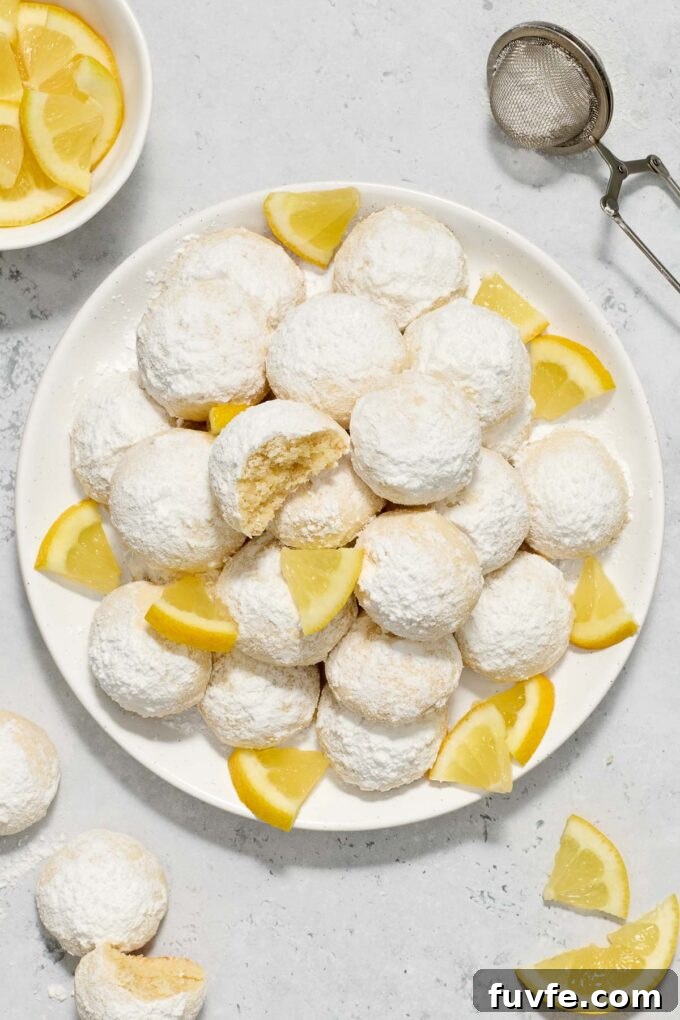 Meyer Lemon Kourabiedes Recipe: Greek Butter Cookies 3 Greek butter cookies with Meyer lemon on a plate.